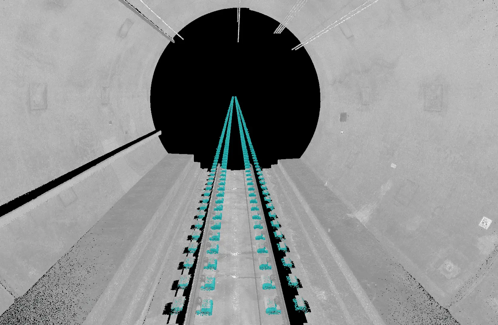 3D point cloud scan of a tunnel interior with cyan-highlighted railway tracks leading into a dark circular opening.